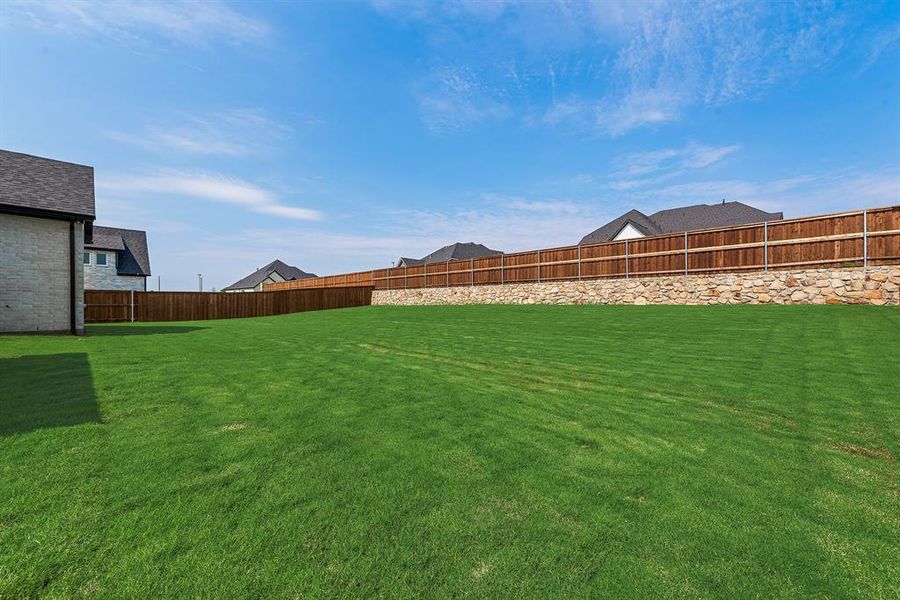 View of fenced backyard