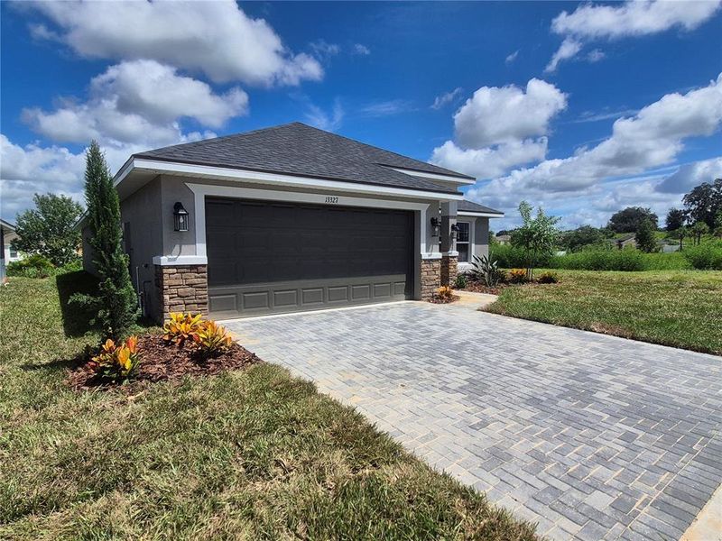 Front exterior of a new home in Abbey Glen, Dade City, FL, highlighting curb appeal (Image 15).