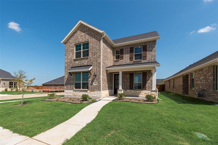 Front exterior of a new home in Arbors at Legacy Hills, Celina, TX, highlighting curb appeal (Image 17).