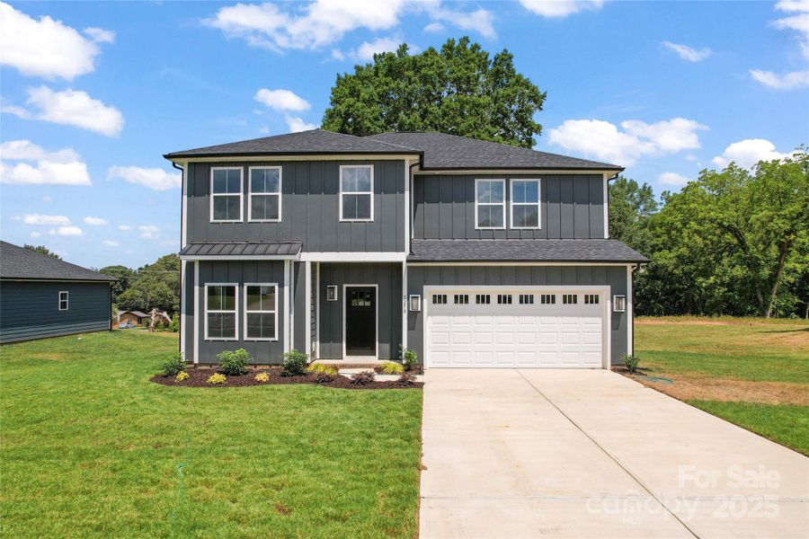 Front exterior of a new home in , Harrisburg, NC, highlighting curb appeal (Image 18).