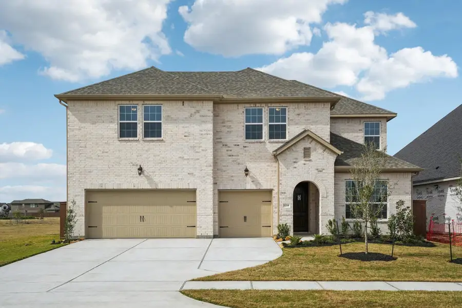 Front exterior of a new home in Del Bello Lakes 60', Manvel, TX, highlighting curb appeal (Image 24).