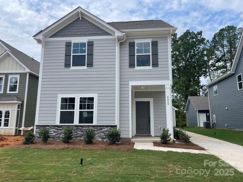 Front exterior of a new home in Arbor Village, Matthews, NC, highlighting curb appeal (Image 12).