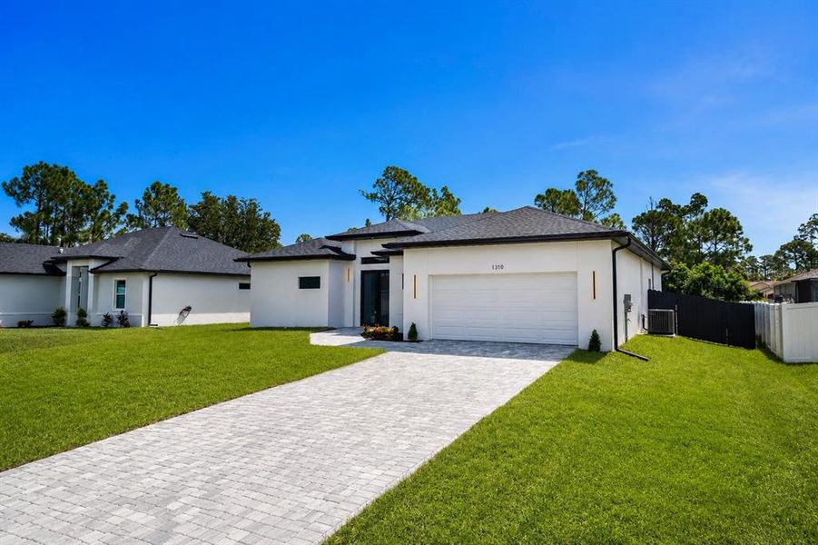 Front exterior of a new home in , North Port, FL, highlighting curb appeal (Image 2). Front exterior of a new home in , North Port, FL, highlighting curb appeal (Image 2).