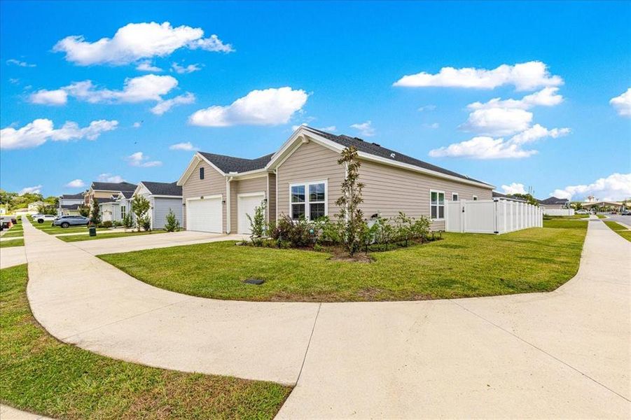 Front exterior of a new home in Millwood, Ocala, FL, highlighting curb appeal (Image 2). Front exterior of a new home in Millwood, Ocala, FL, highlighting curb appeal (Image 2).