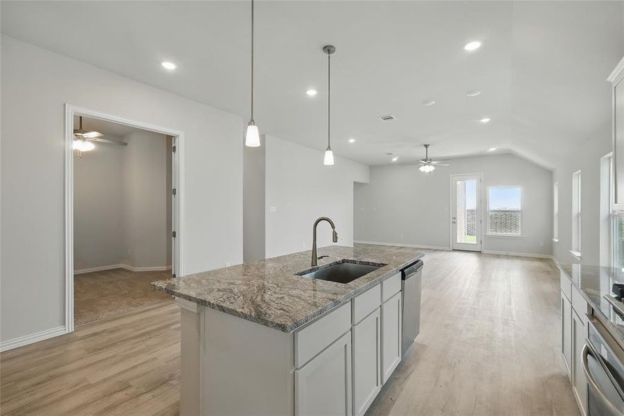 Kitchen with a sink, ceiling fan, light wood-style floors, appliances with stainless steel finishes, and recessed lighting