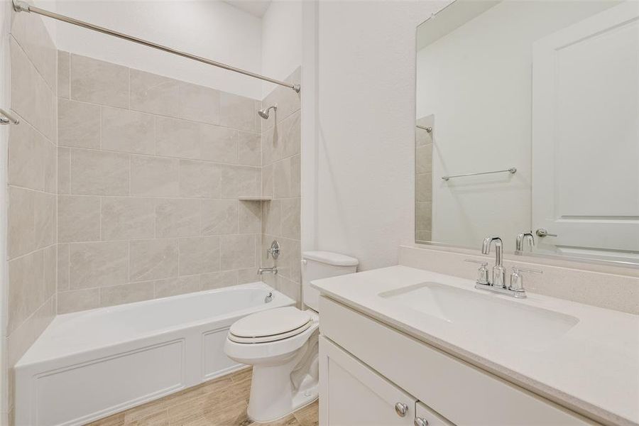 Bathroom featuring vanity and shower / bathtub combination Bathroom featuring vanity and shower / bathtub combination