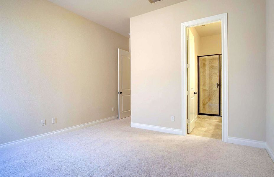 Representative unfurnished interior of a home built from the 3710 by Ravenna Homes in Artavia 70′, Conroe (Image 37).