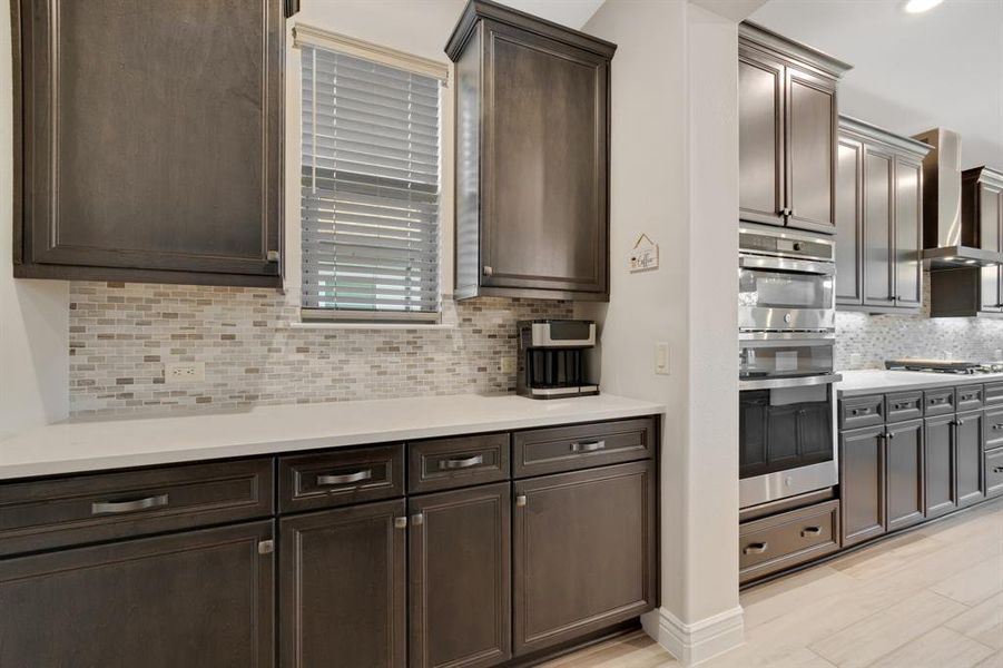 Across from the spacious walk-in pantry is this terrific Butler's Pantry.