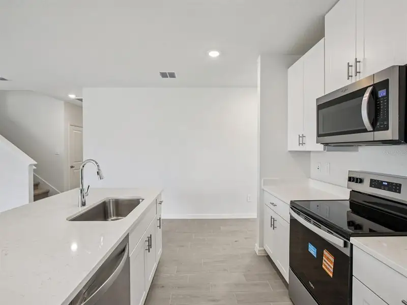 Furnished interior view inside a new home in Magnolia Bay - Classic Series, Nokomis (Image 4).