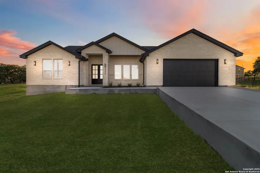 Front exterior of a new home in , Blanco, TX, highlighting curb appeal (Image 1).