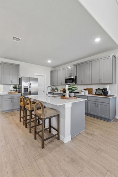 Kitchen in a Sunset Ranch Winters Model Home in Gunter TX by Trophy Signature Homes
