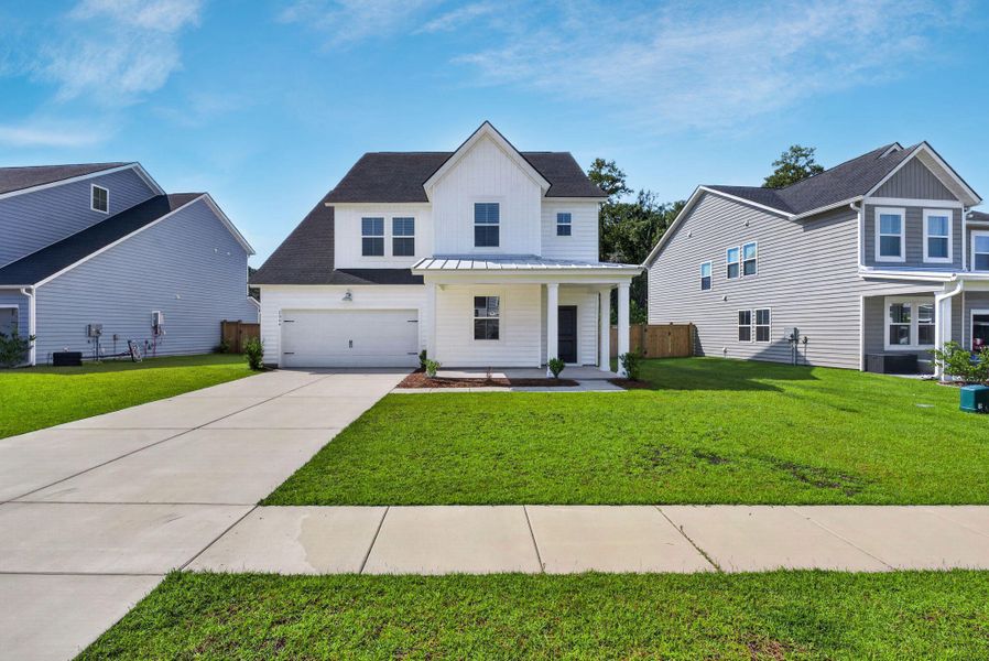 Front exterior of a new home in Sweetgrass at Summers Corner, Summerville, SC, highlighting curb appeal (Image 30).