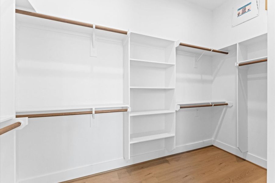 Expansive walk-in primary closet Expansive walk-in primary closet