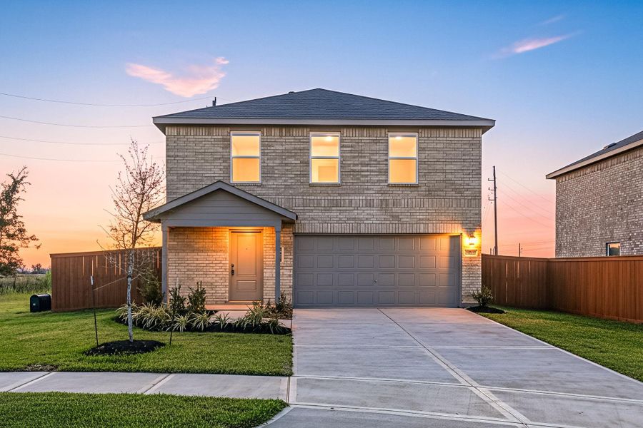 Front exterior of a new home in Emberly: Cottage Collection, Beasley, TX, highlighting curb appeal (Image 1).