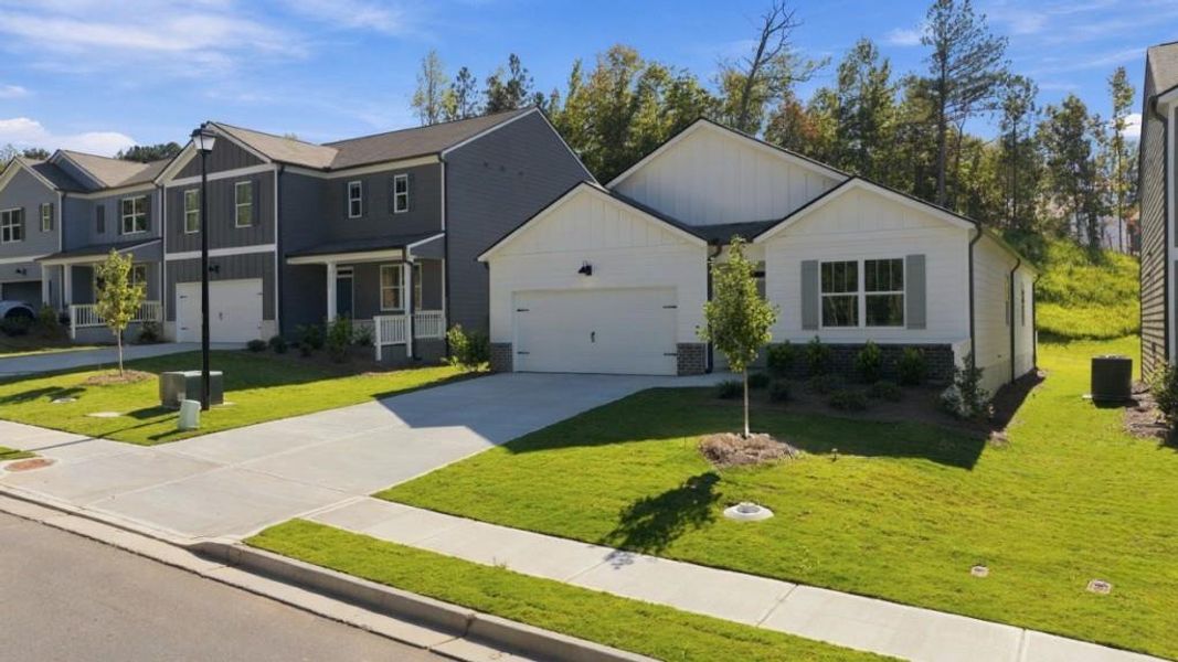 Front exterior of a new home in Oconee Overlook, Gainesville, GA, highlighting curb appeal (Image 2). Front exterior of a new home in Oconee Overlook, Gainesville, GA, highlighting curb appeal (Image 2).