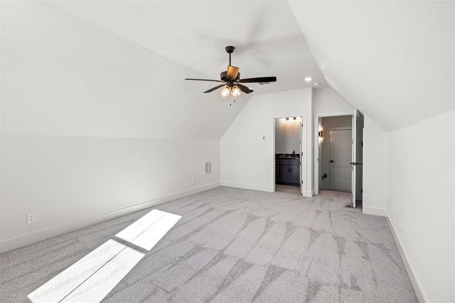 Unfurnished bedroom with ceiling fan, light colored carpet, and a closet