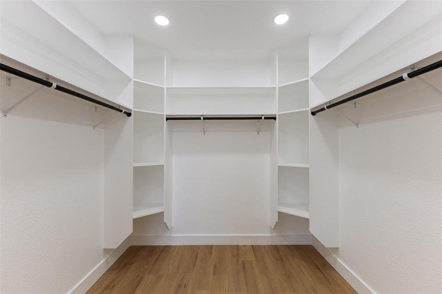 Walk in closet featuring light wood finished floors
