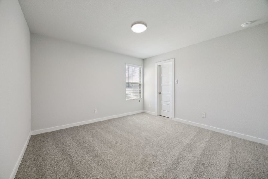 Bedroom in the Haylee home plan by Trophy Signature Homes - REPRESENTATIVE PHOTO Bedroom in the Haylee home plan by Trophy Signature Homes - REPRESENTATIVE PHOTO