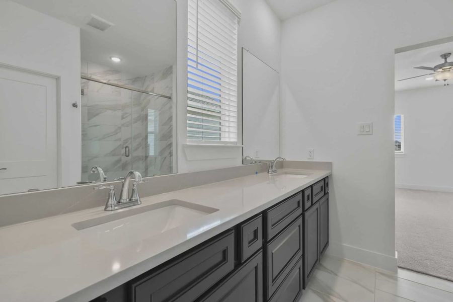 Representative furnished interior of a home built from the Riverdale by Chesmar Homes in Meridiana Courtyard Collection, Manvel (Image 11).