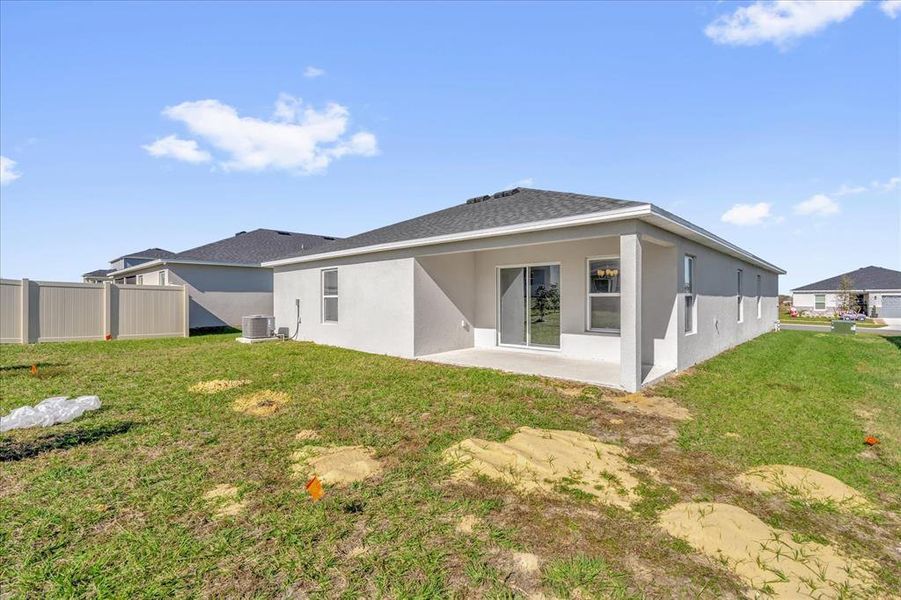 Exterior details and patio area of a home in Landings at Lake Mabel Loop, Dundee (Image 4).