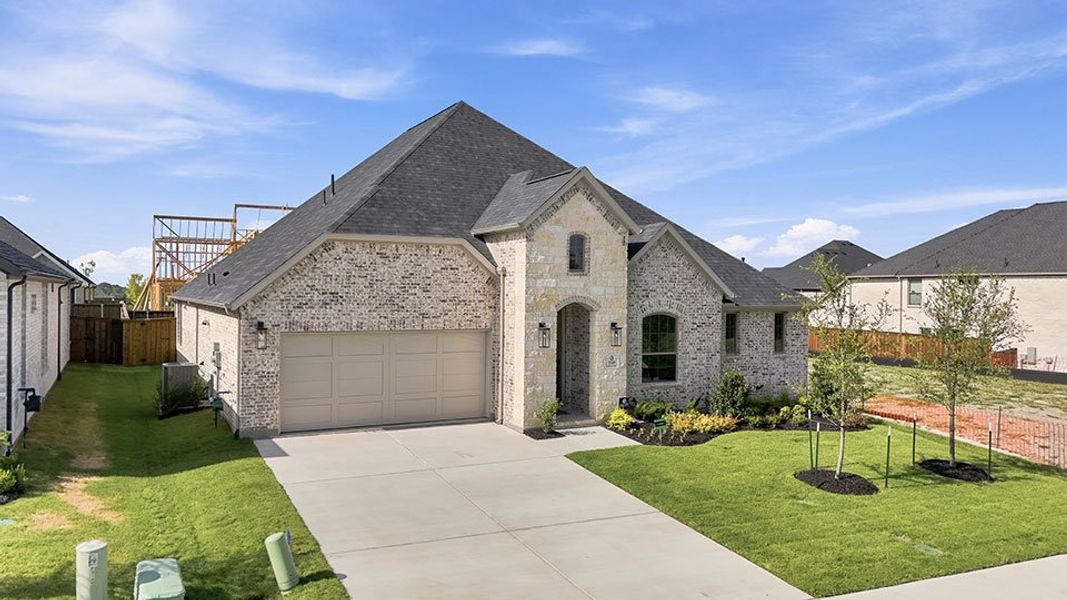 Front exterior of a new home in The Homestead - 62', Rockwall, TX, highlighting curb appeal (Image 24).