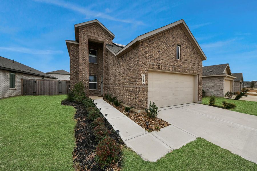 Front exterior of a new home in , Hockley, TX, highlighting curb appeal (Image 26).