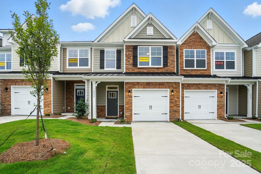 Front exterior of a new home in Harrisburg Village Townhomes, Harrisburg, NC, highlighting curb appeal (Image 2). Front exterior of a new home in Harrisburg Village Townhomes, Harrisburg, NC, highlighting curb appeal (Image 2).