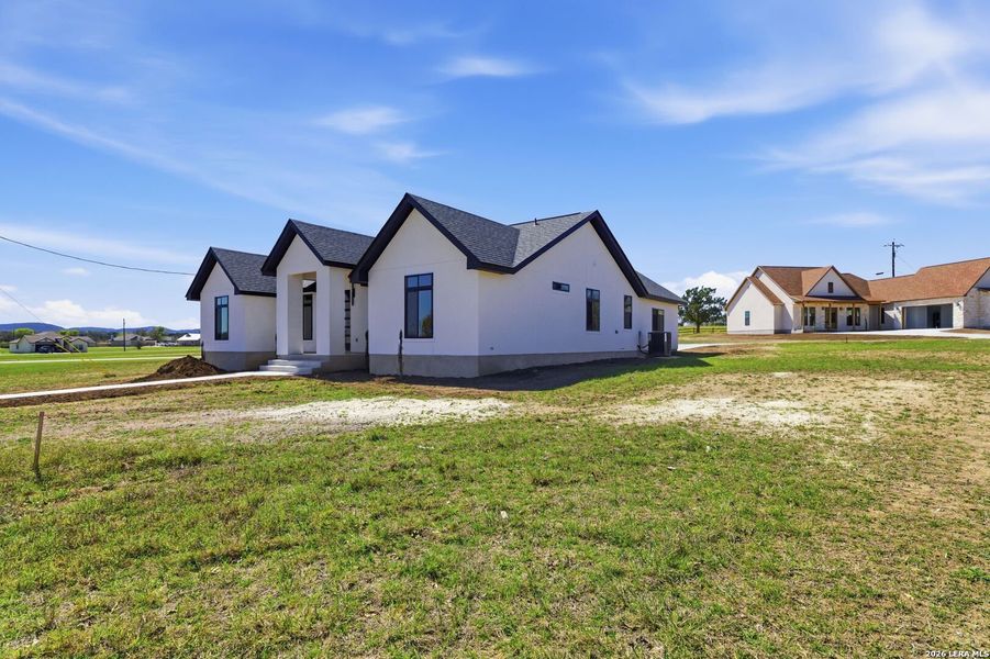 Exterior details and patio area of a home in , Bandera (Image 3).