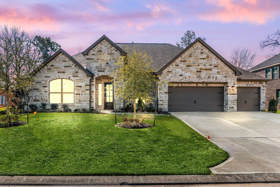 Front exterior of a new home in Stewart’s Forest, Conroe, TX, highlighting curb appeal (Image 2).