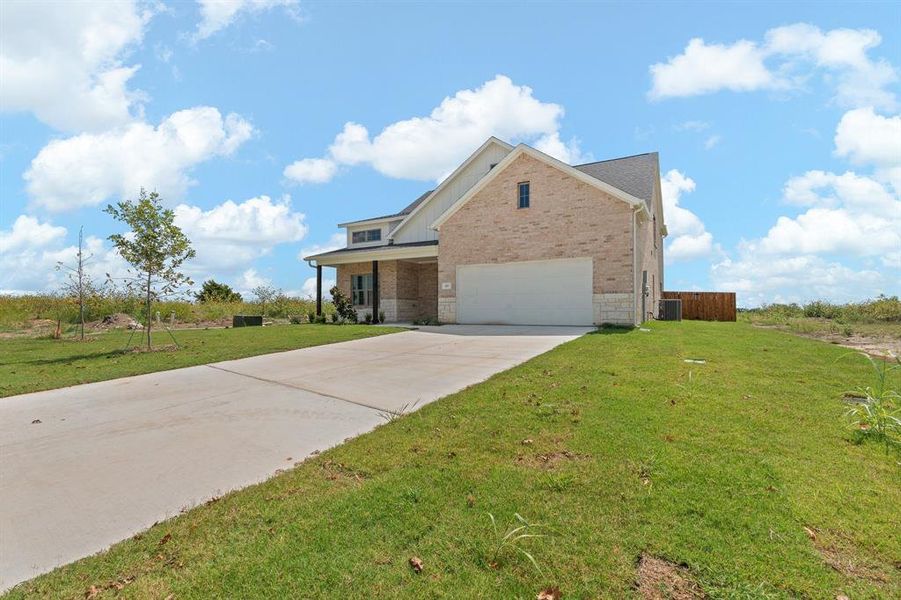Front exterior of a new home in , Venus, TX, highlighting curb appeal (Image 19).