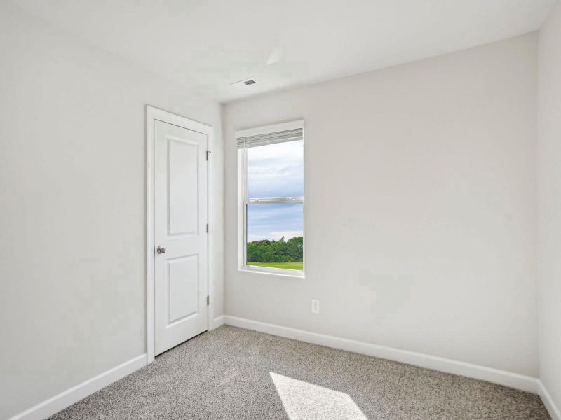 A secondary bedroom for guests or a reading nook. A secondary bedroom for guests or a reading nook.