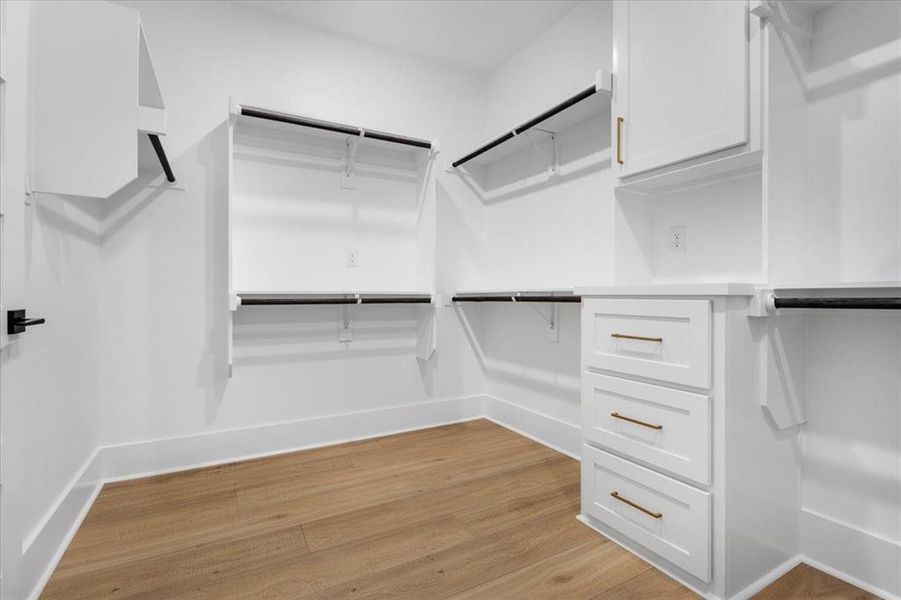 Walk in closet featuring light wood finished floors