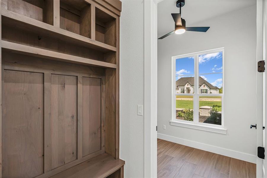Mudroom featuring wood finished floors and ceiling fan Mudroom featuring wood finished floors and ceiling fan