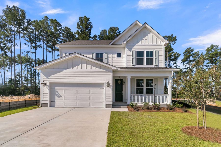 Front exterior of a new home in Tidewater at Lakes of Cane Bay, Summerville, SC, highlighting curb appeal (Image 21). Front exterior of a new home in Tidewater at Lakes of Cane Bay, Summerville, SC, highlighting curb appeal (Image 21).