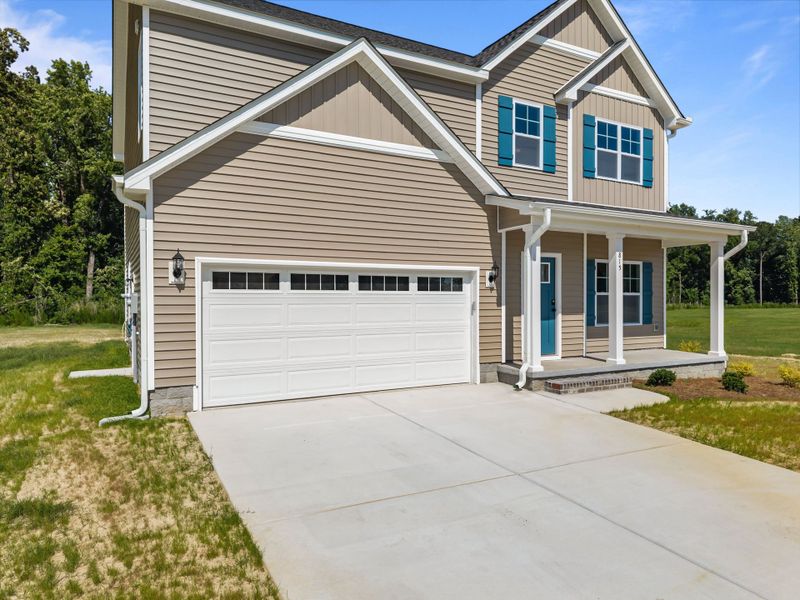 Front exterior of a new home in Laurel Oaks, Greenville, NC, highlighting curb appeal (Image 23). Front exterior of a new home in Laurel Oaks, Greenville, NC, highlighting curb appeal (Image 23).
