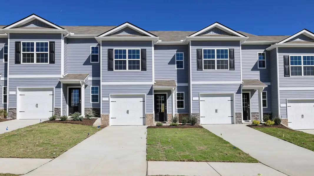 Front exterior of a new home in Paddington Place, Baxter, TN, highlighting curb appeal (Image 1). Front exterior of a new home in Paddington Place, Baxter, TN, highlighting curb appeal (Image 1).