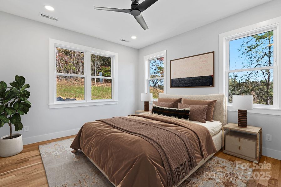 Virtually Staged -The owner's suite is located on the main level, just off the living room.