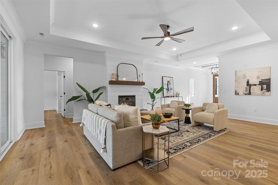 *representative photo- family room w/ tray ceiling, shiplap fireplace & cedar mantle!