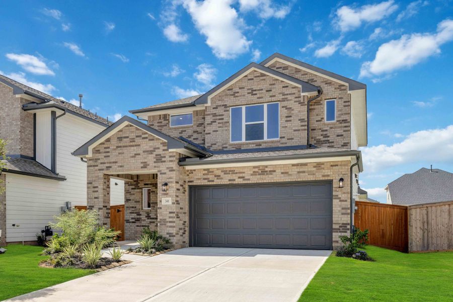 Front exterior of a new home in La Segarra 40', Brookshire, TX, highlighting curb appeal (Image 2). Front exterior of a new home in La Segarra 40', Brookshire, TX, highlighting curb appeal (Image 2).