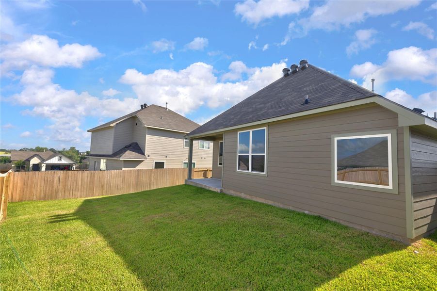Exterior details and patio area of a home in Vintage Farms, Brenham (Image 29).