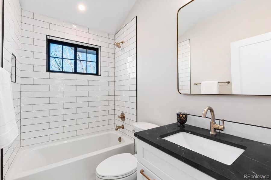 Secondary full bath with timeless finishes Secondary full bath with timeless finishes