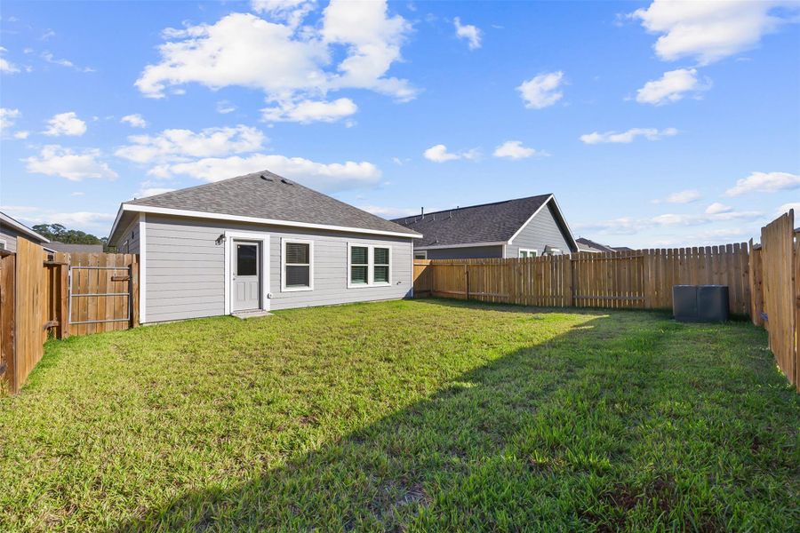 Exterior details and patio area of a home in Enclave at Dobbin, Magnolia (Image 4).