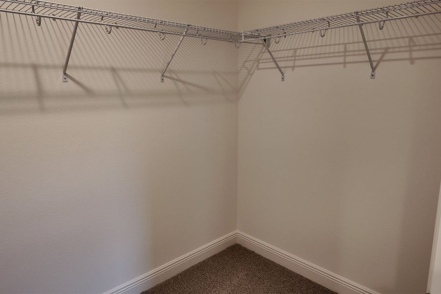 Organized Primary Bedroom Closet in Central Florida House Organized Primary Bedroom Closet in Central Florida House