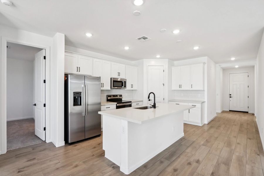 Kitchen featuring the Harmony Collection. Not actual home, finishes may vary by community. Kitchen featuring the Harmony Collection. Not actual home, finishes may vary by community.