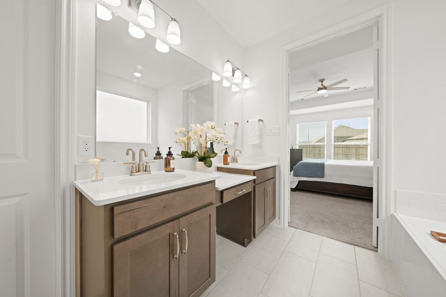 The dual sinks with vanity provide ample space and functionality.