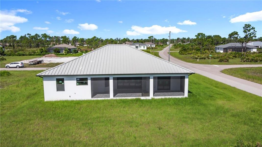 Front exterior of a new home in , Placida, FL, highlighting curb appeal (Image 23). Front exterior of a new home in , Placida, FL, highlighting curb appeal (Image 23).
