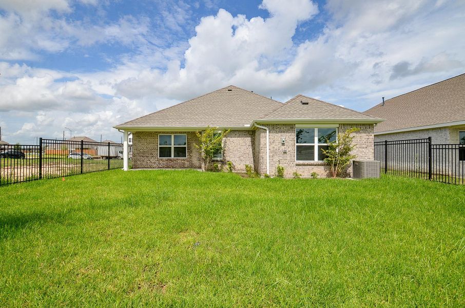 Exterior details and patio area of a home in Sunterra, Katy (Image 2).