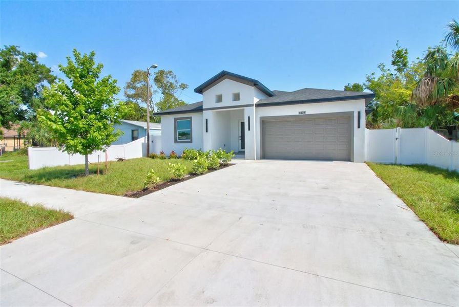 Front exterior of a new home in , Pinellas Park, FL, highlighting curb appeal (Image 28).