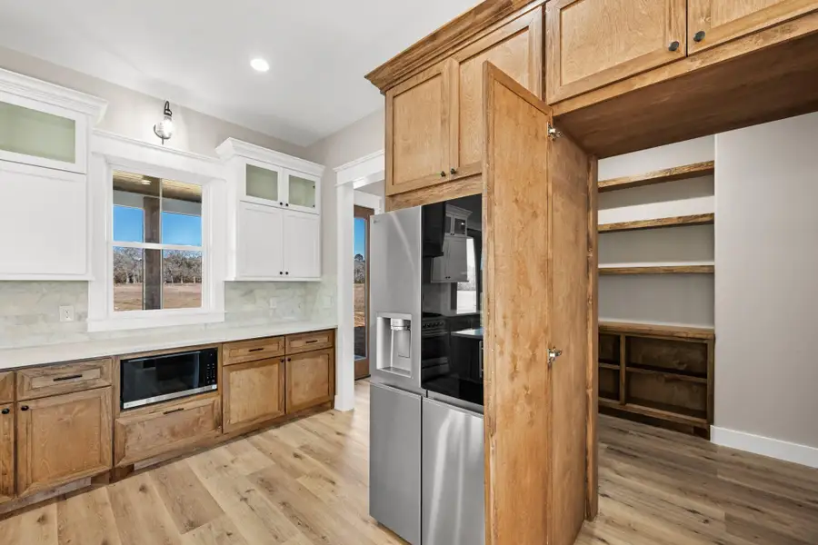 Furnished interior view inside a new home in , New Waverly (Image 5).