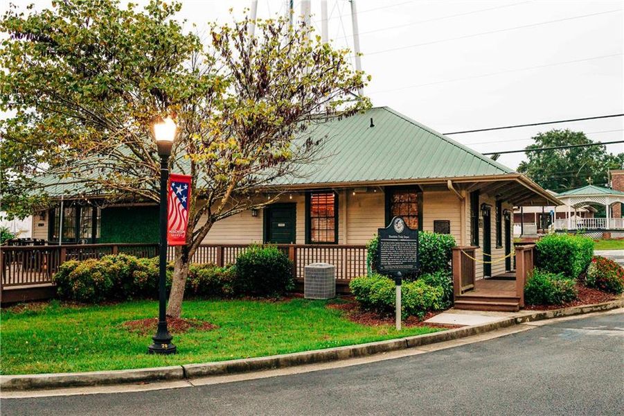 Front exterior of a new home in Rosewood Lake Estates, Hoschton, GA, highlighting curb appeal (Image 65).